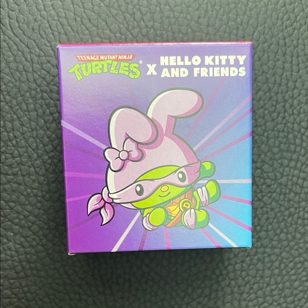 McDonald's Teenage Mutant Ninja Turtles x Hello Kitty Toy - Purple and Green
